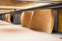 Wooden donor wall installation designed and fabricated by Daly Co. for the 2015 Canada Winter Games in Prince George, featuring modular 2x4 segments honouring community supporters. 